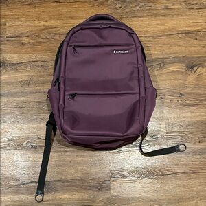 Women’s Purple LaPacker Backpack (18.8”x12.9”x6.2”) (HxLxW) Like New
